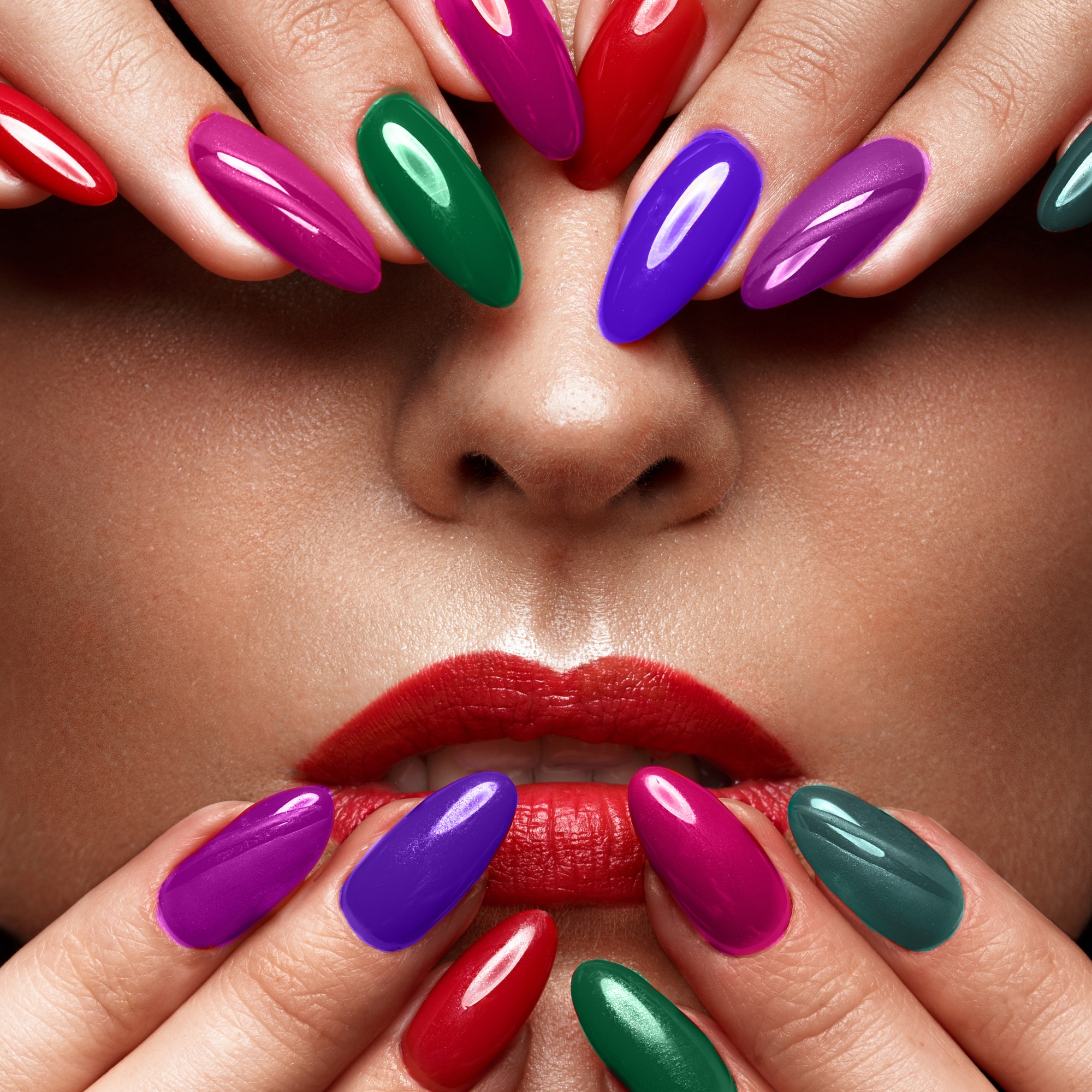 Beautiful girl with a classic make-up and multi-colored nails. Manicure design. Beauty face.